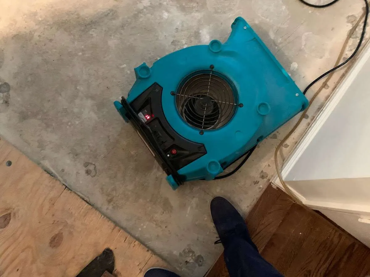 Air mover drying subfloor during Leak Detection & Repair in Vero Beach